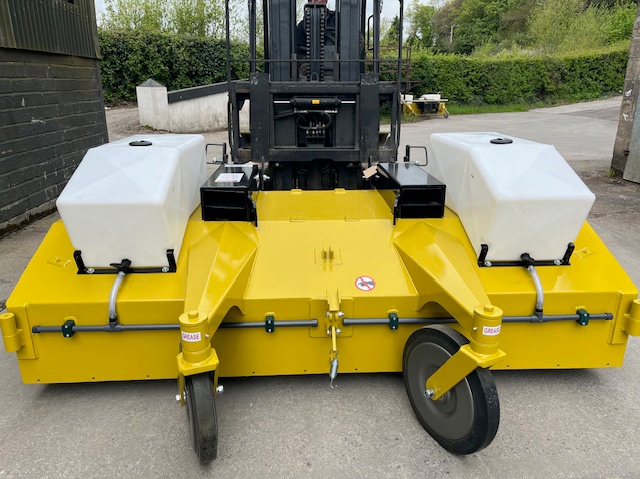Close-up of heavy-duty forklift sweeper wheel and reinforced construction