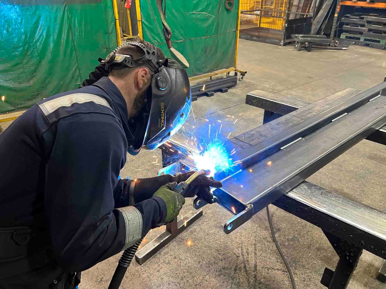 Manufacturing forklift attachments in Contact Attachments workshop