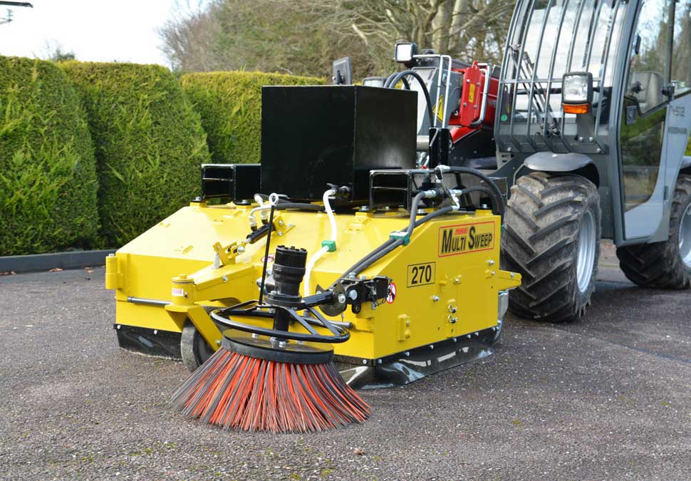 Heavy-duty forklift road sweeper operating in an industrial yard